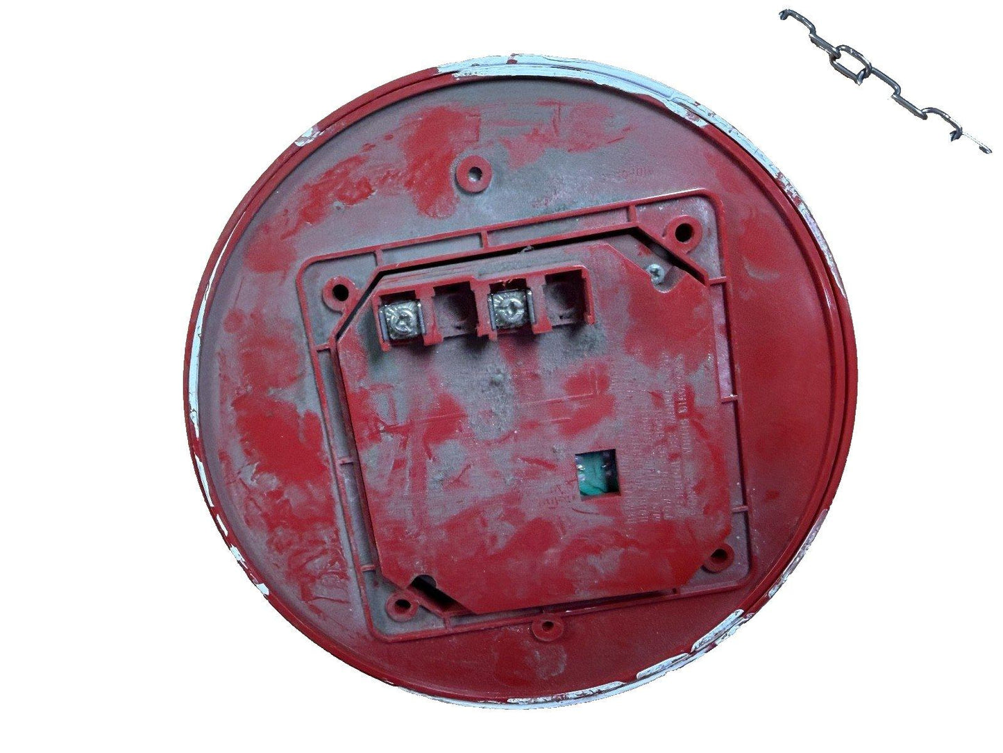 Used red fire alarm bell with mounting bracket and chain, showing wiring terminals and wear
