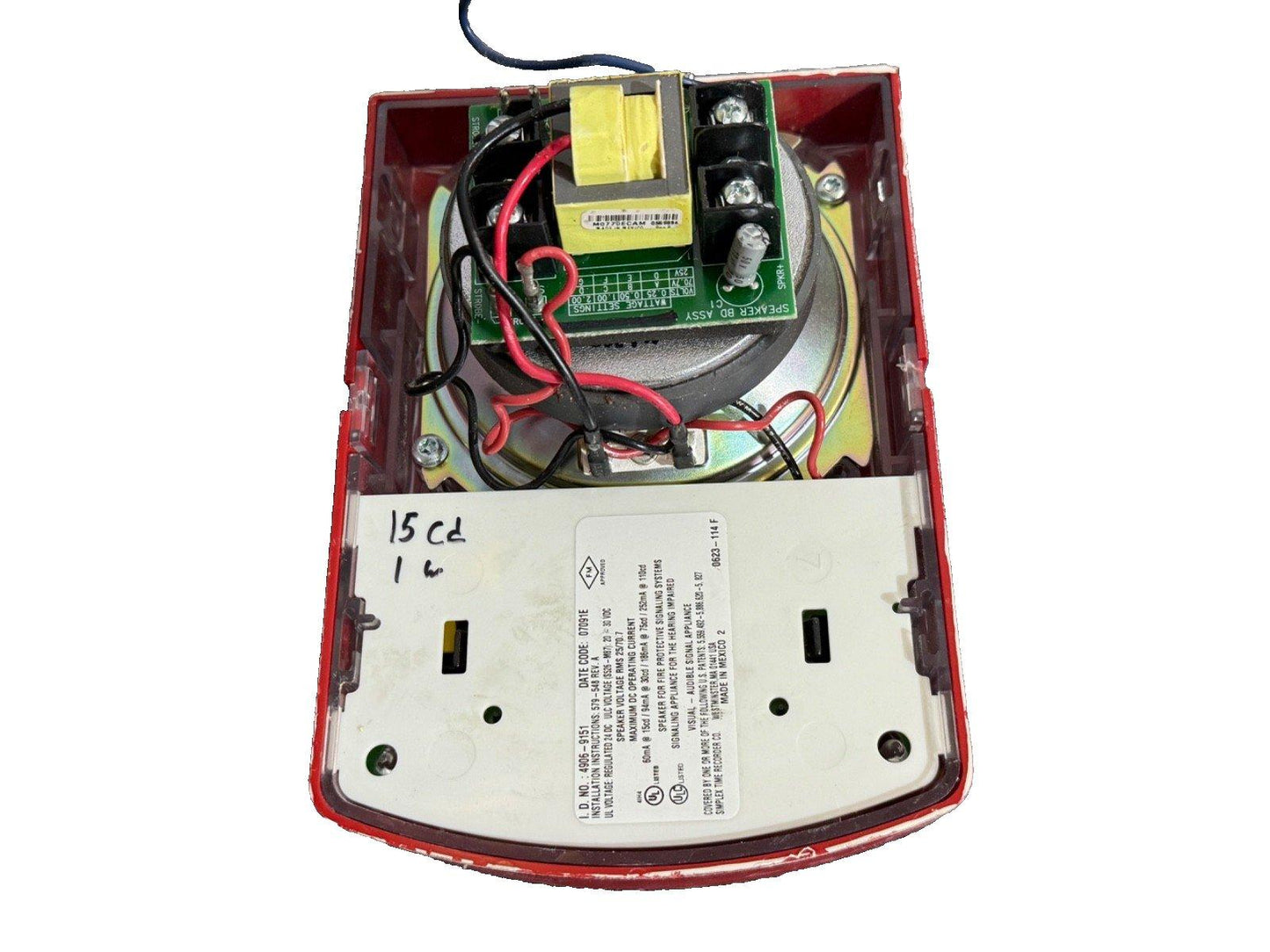 Fire alarm speaker with exposed circuit board, wiring, and UL label for fire protection systems