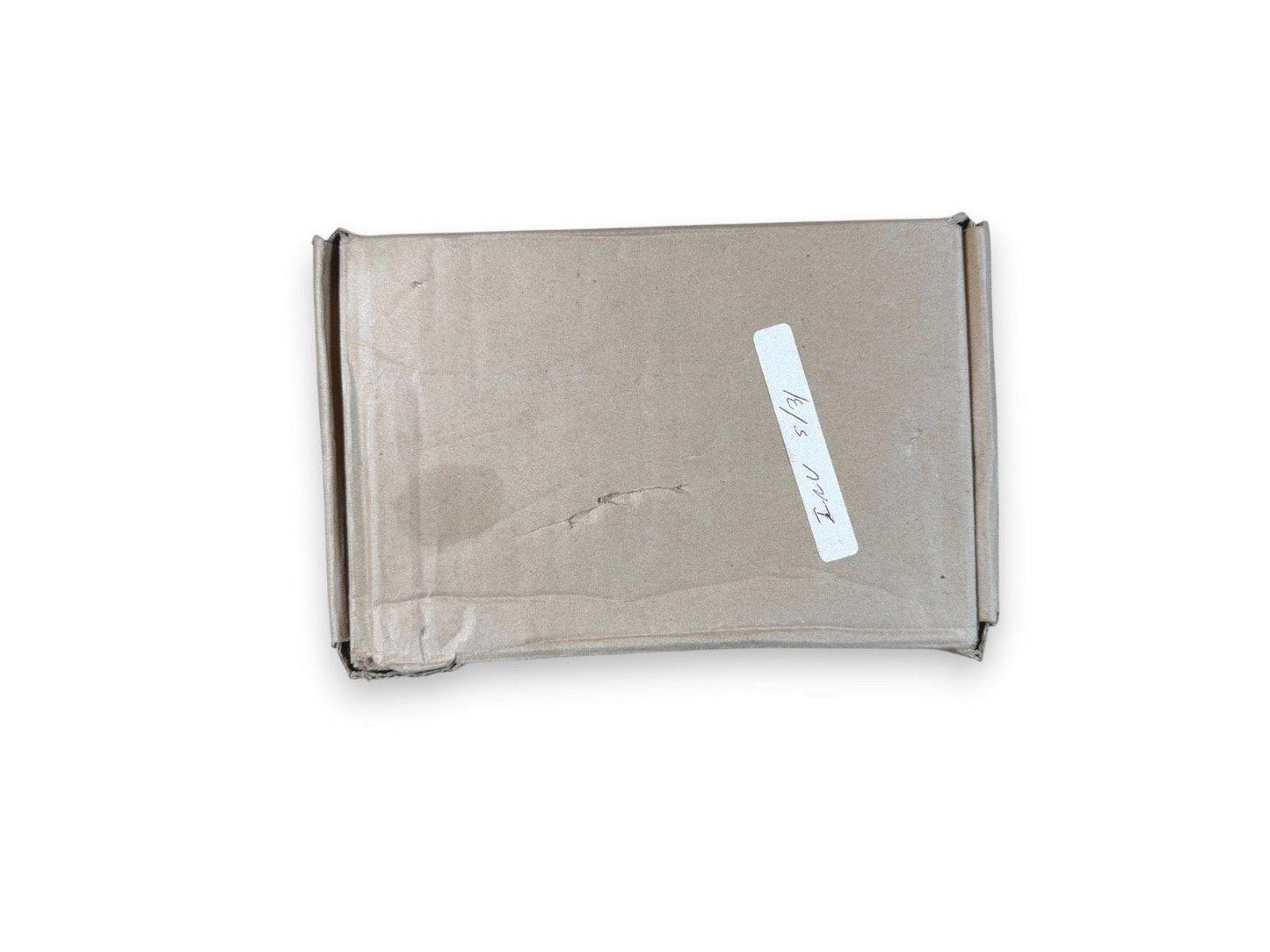 Used fire alarm equipment in plain cardboard box with handwritten label, ready for shipping