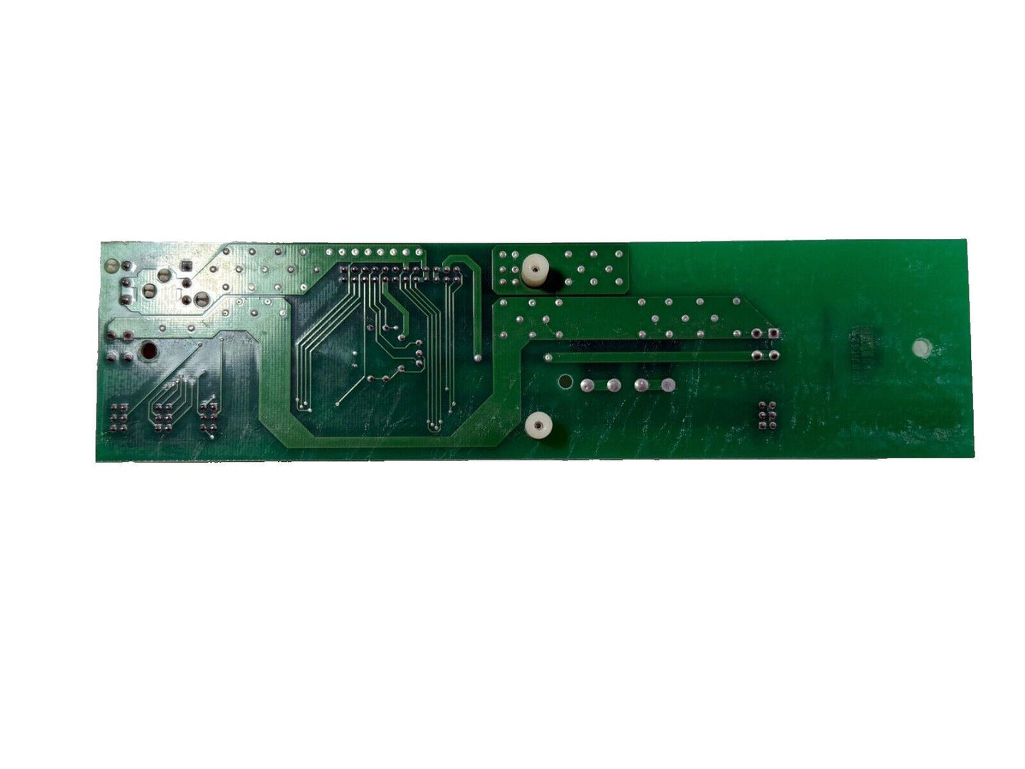 Green fire alarm control panel circuit board with solder points and traces
