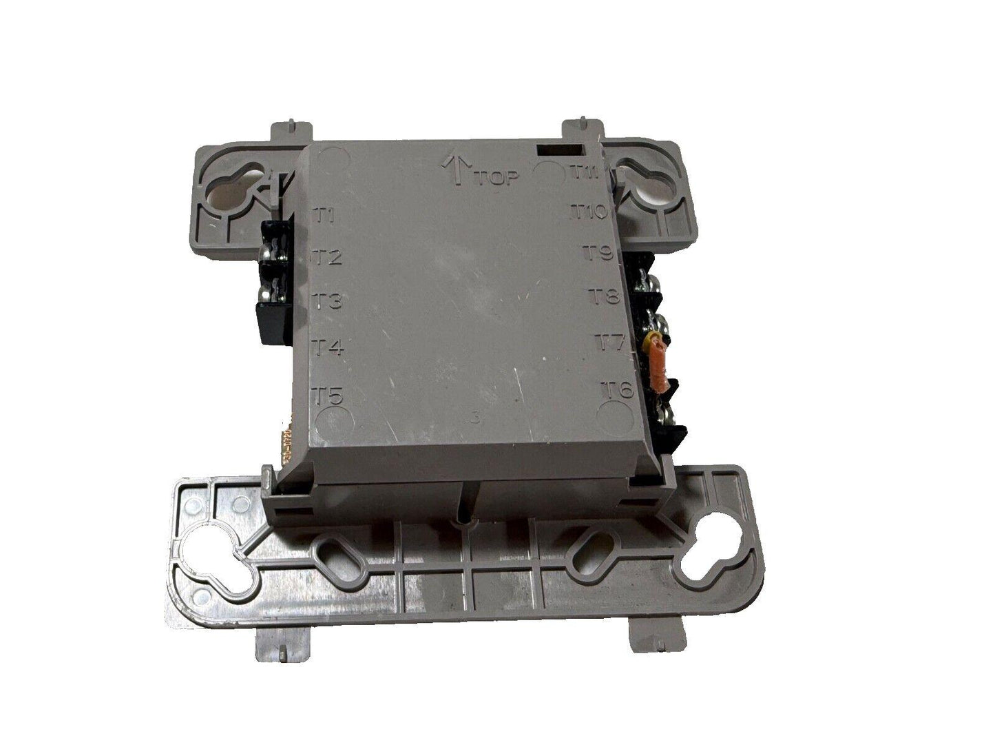 Fire alarm control module with terminal labels T1-T11, gray plastic housing, wiring connectors visible