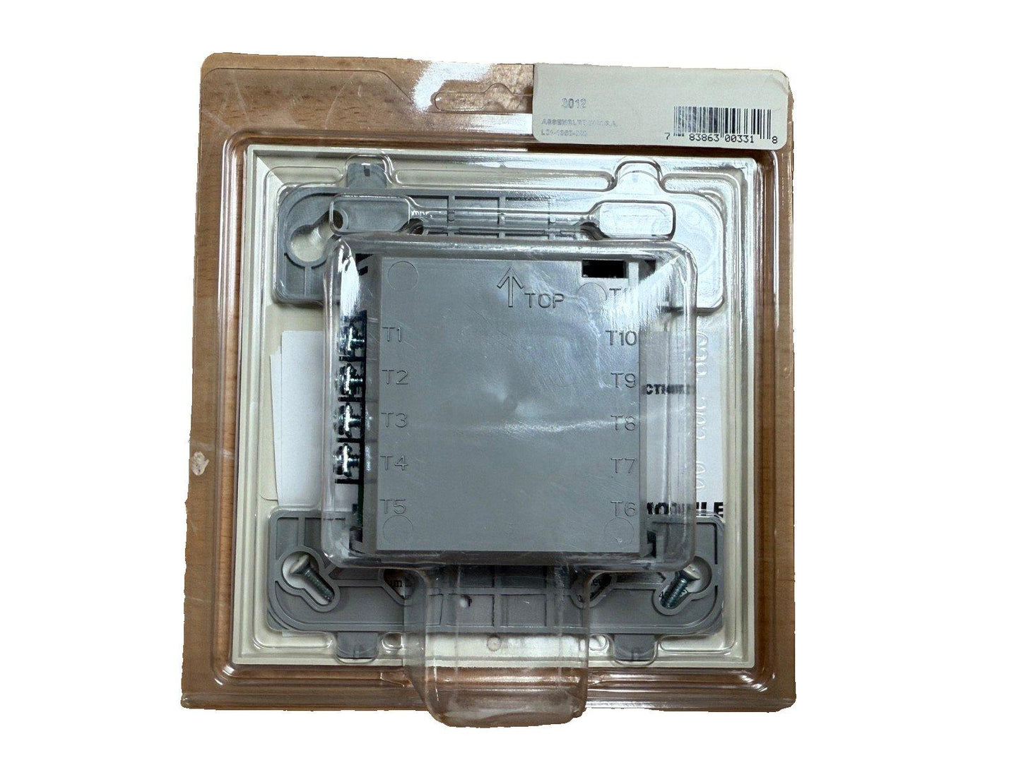 Fire alarm control module in sealed packaging, labeled T1-T10, for commercial security systems