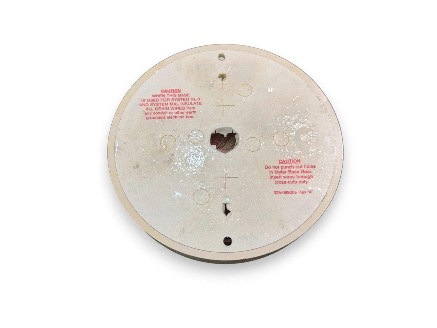 Fire alarm base with wiring instructions, caution labels, and Mylar seal for System XL-3 and MXL installations