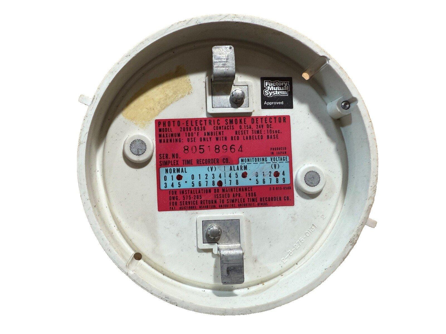 Photo-electric smoke detector with wiring terminals and Factory Mutual approval label, model 2098-9636