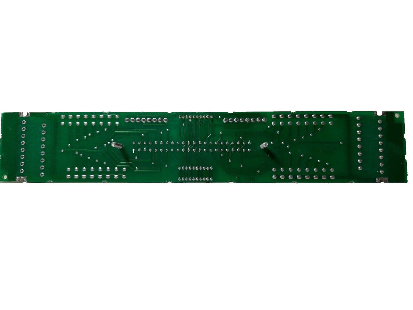 Green fire alarm control panel circuit board with solder points and traces