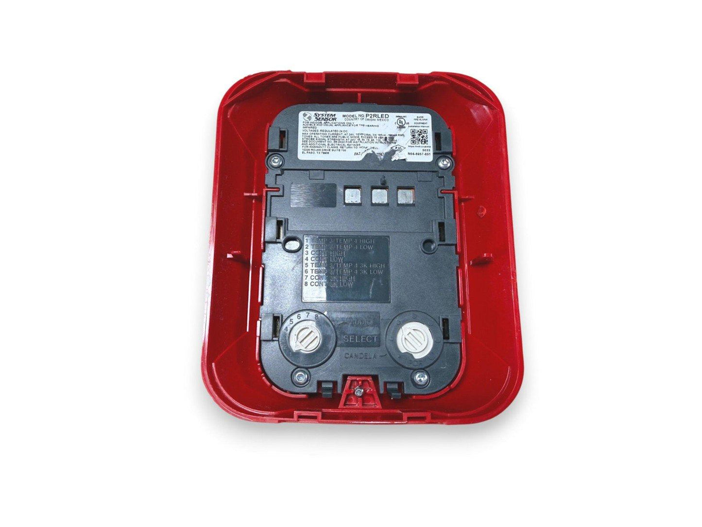 System Sensor P2RLED fire alarm device with red cover, showing wiring terminals and model label for commercial use