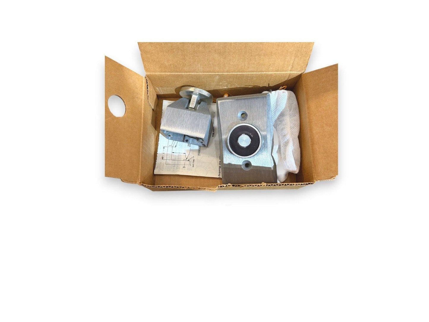 Fire alarm pull station components in open box with instructions and mounting hardware
