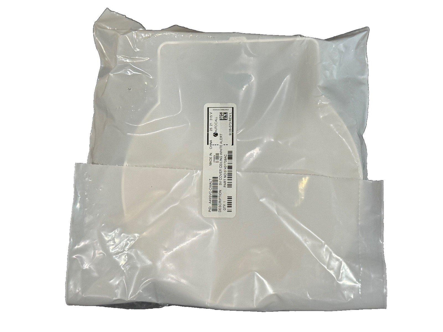 White ceiling fire alarm cover in plastic packaging, labeled SV Cover Ceiling White Alert for fire safety systems