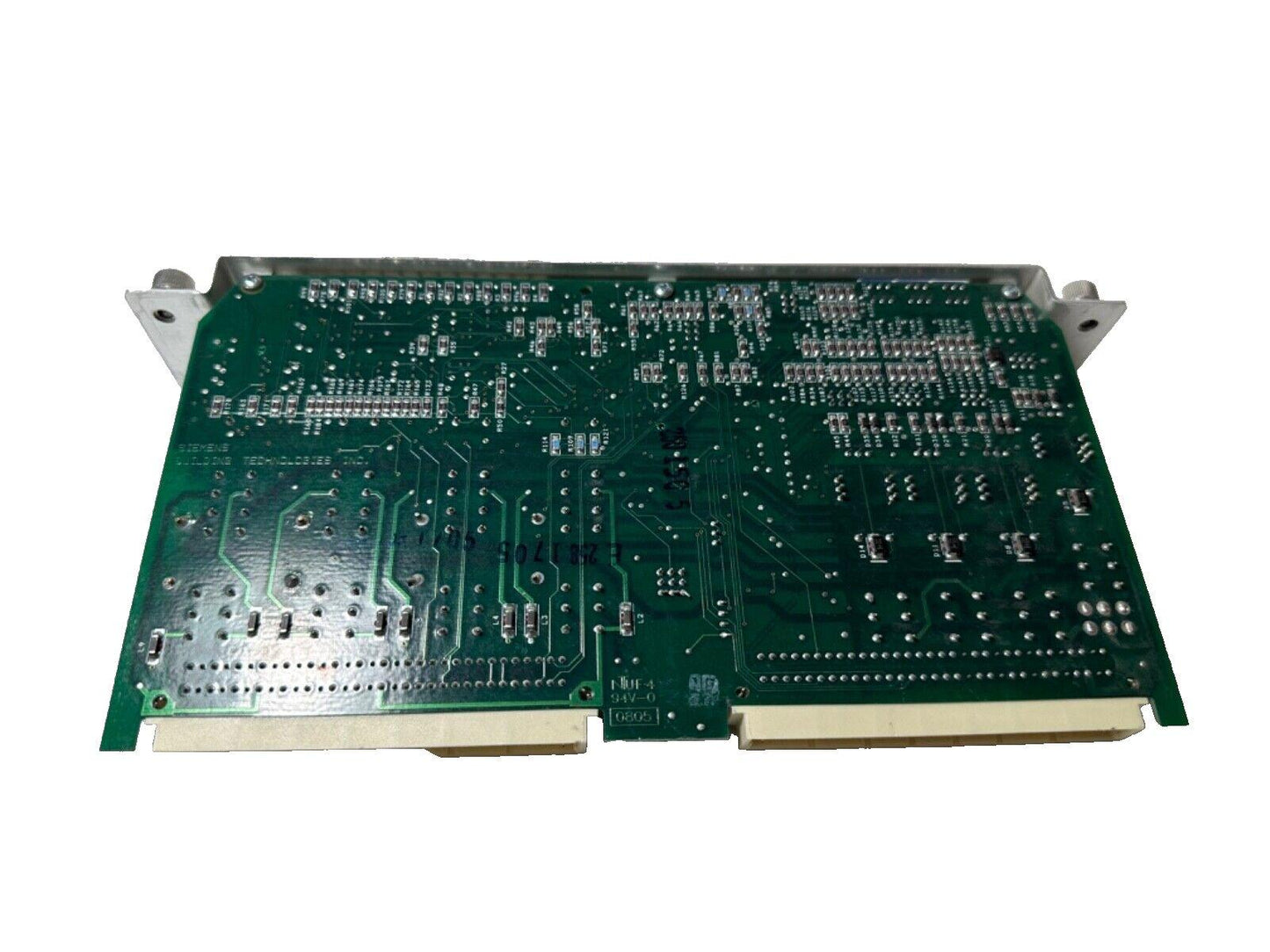 Siemens fire alarm control panel circuit board with green PCB and connectors