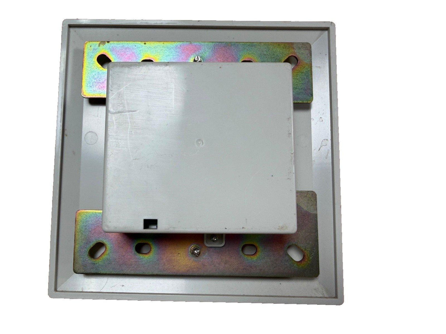 Fire alarm control panel module with mounting bracket and metal backplate