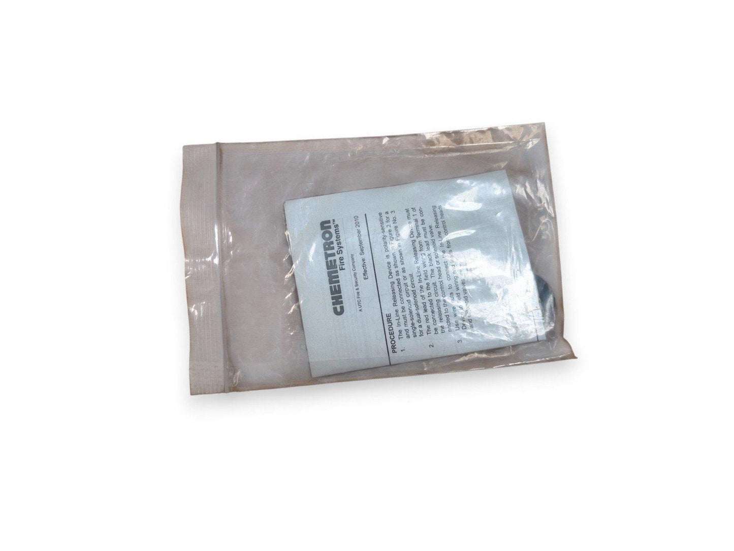 Chemetron fire alarm system instruction sheet in clear plastic packaging