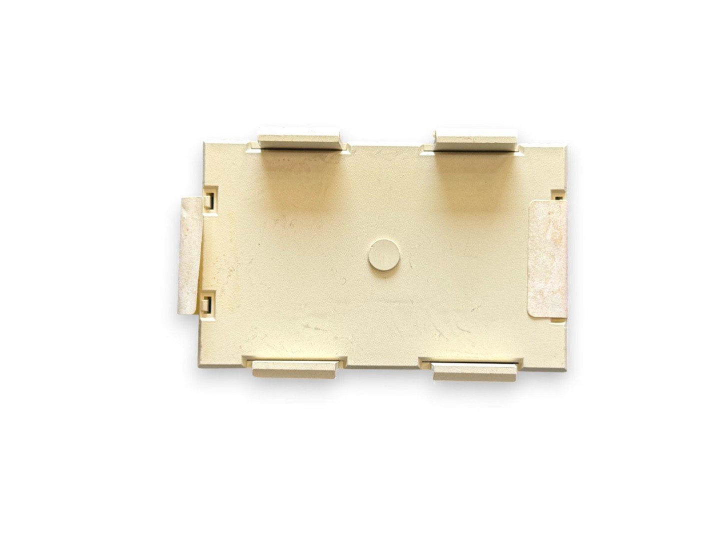 Beige fire alarm mounting bracket with clips and central hole for secure installation