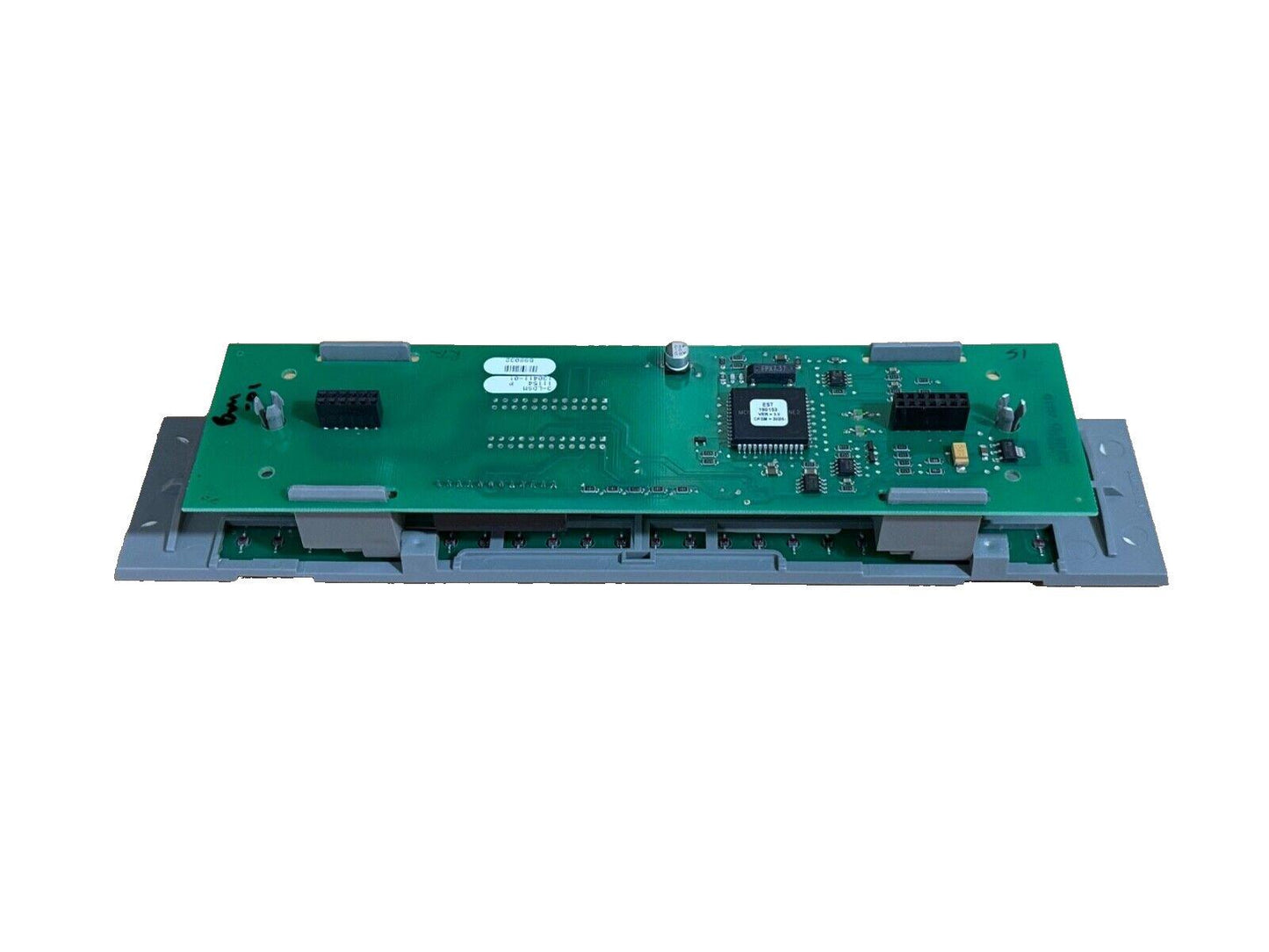 Green fire alarm control panel circuit board with connectors and microchip, used fire alarm equipment
