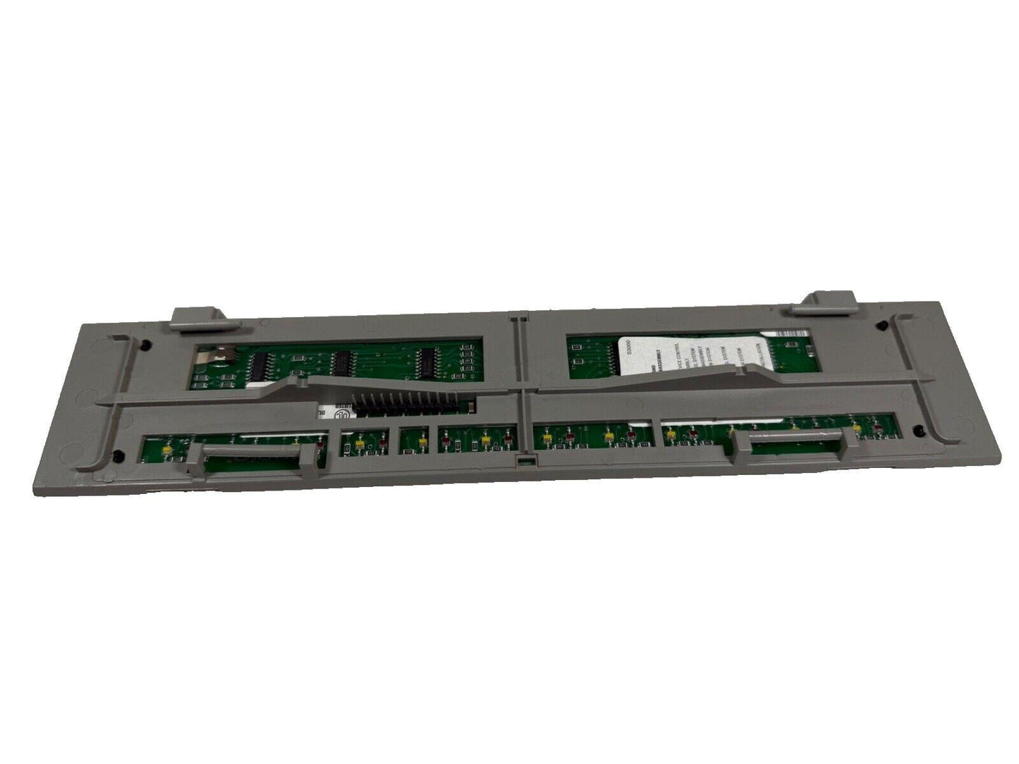 Fire alarm control panel circuit board with green PCBs and connectors for fire safety systems