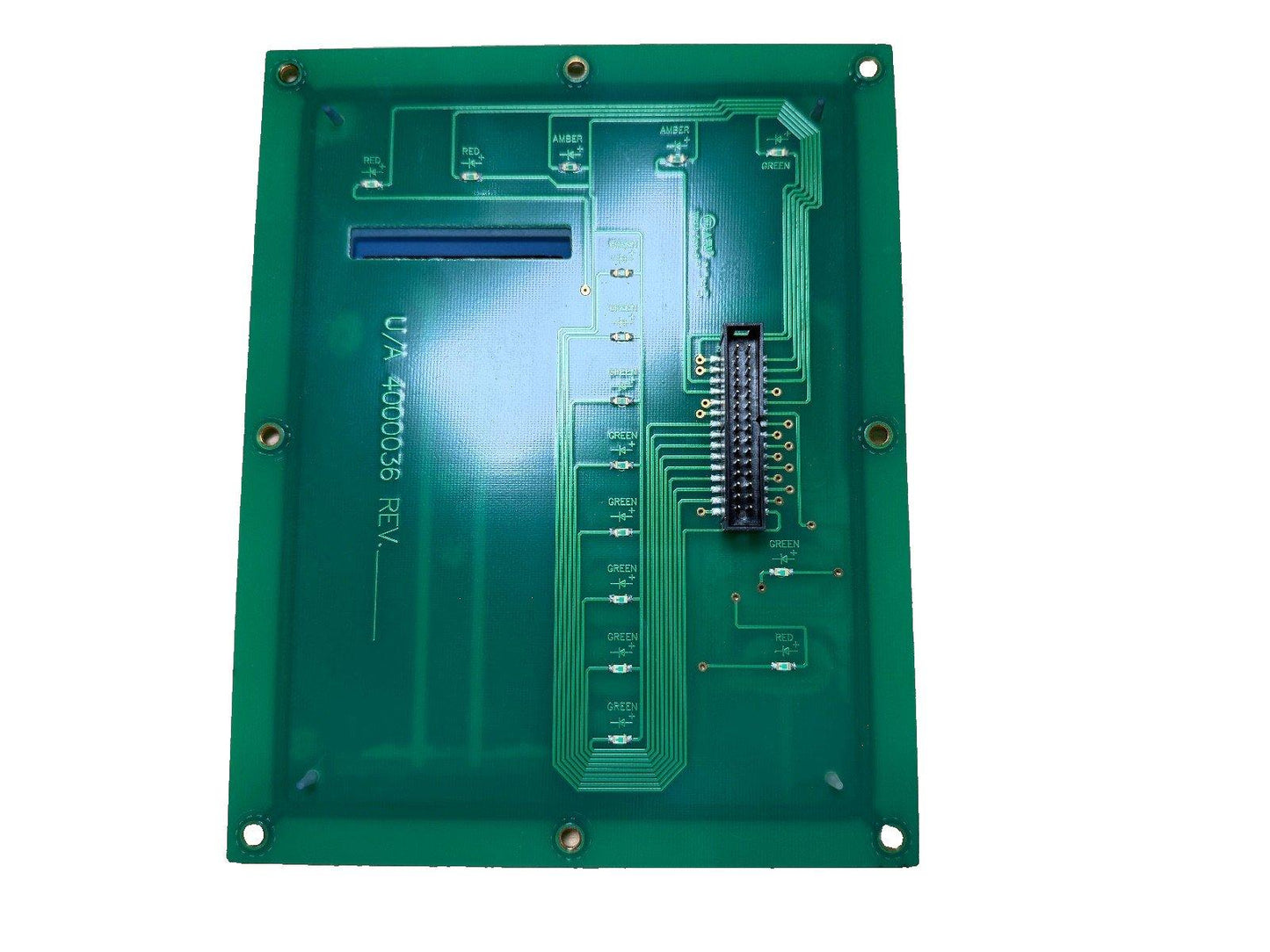 Green fire alarm control panel circuit board with labeled terminals and connector pins