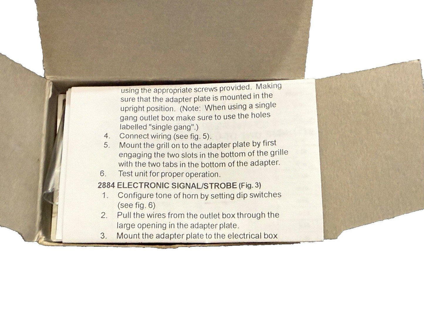 Installation manual for 2884 Electronic Signal/Strobe fire alarm device in open box