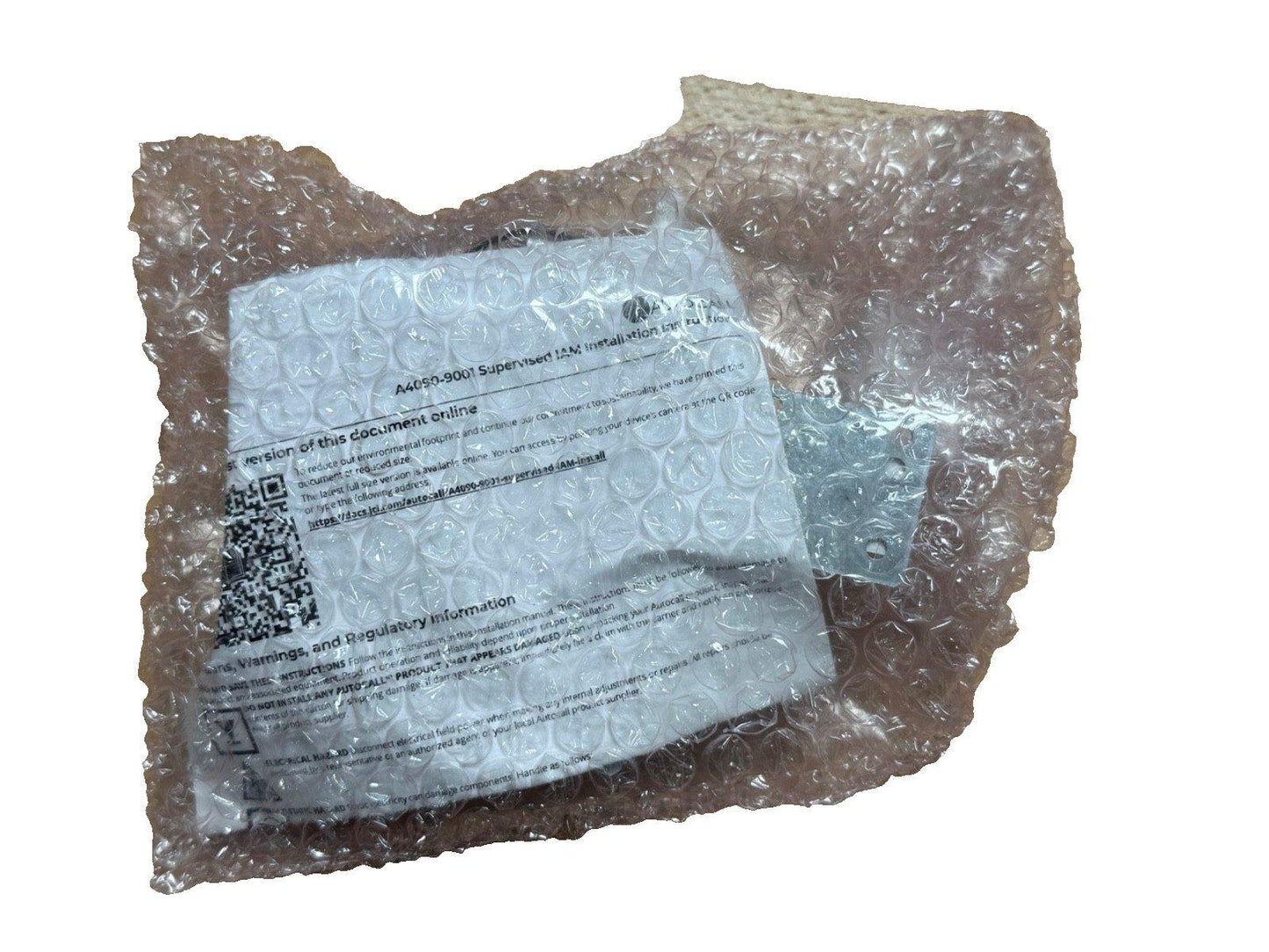 A4050-9001 Supervised IAM installation manual wrapped in bubble wrap for fire alarm equipment