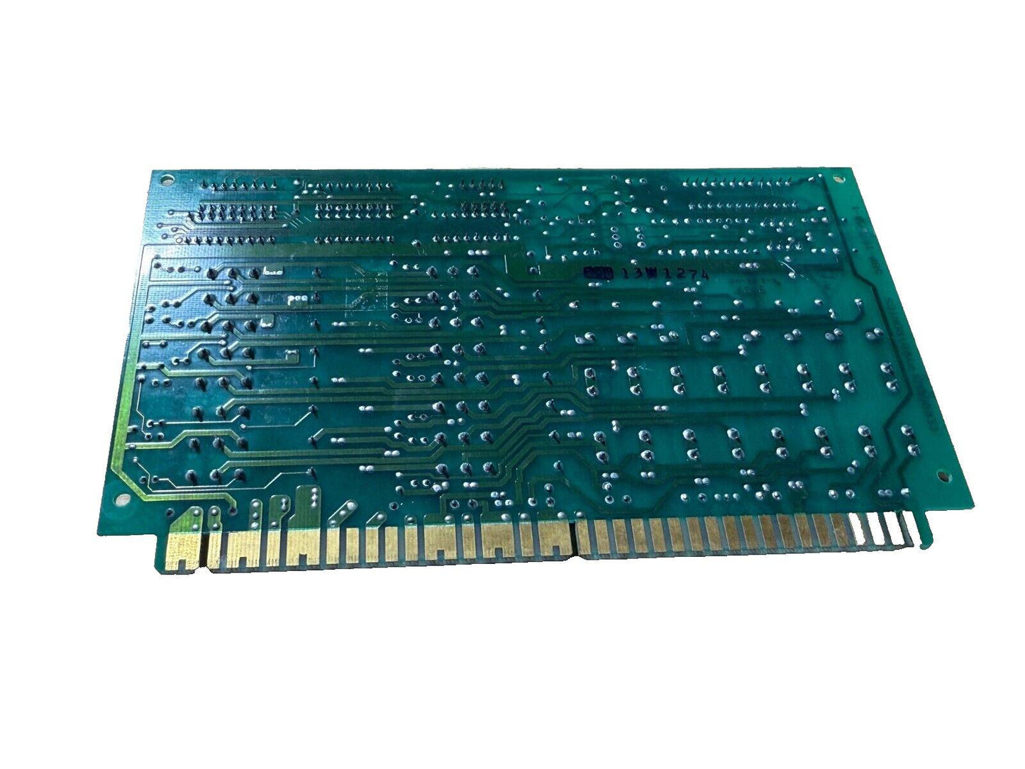 Green fire alarm control panel circuit board with gold edge connectors, used fire alarm equipment