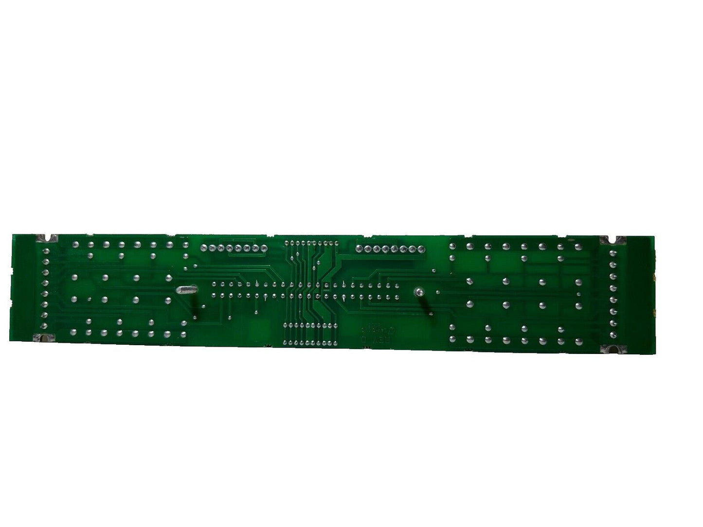 Green fire alarm control panel circuit board with solder points and traces