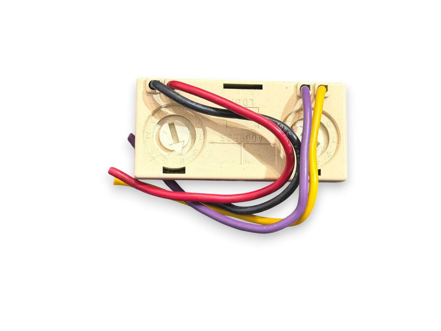 Fire alarm addressable module with red, black, purple, and yellow wires connected