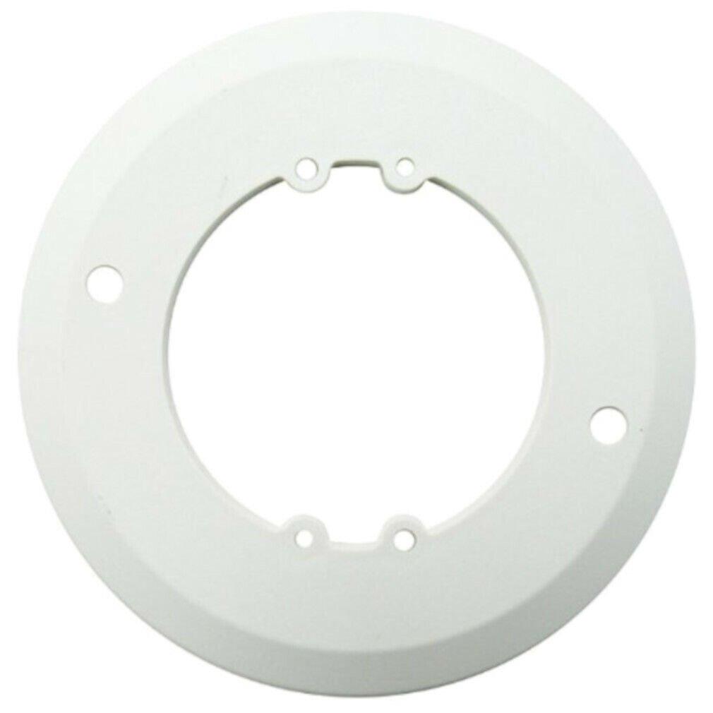 White fire alarm base plate with mounting holes for ceiling installation