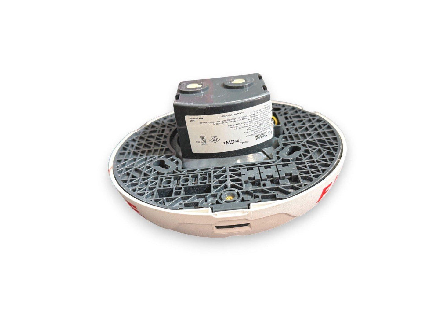 System Sensor SPCWL fire alarm detector with mounting base, shown from underside with label and wiring terminals