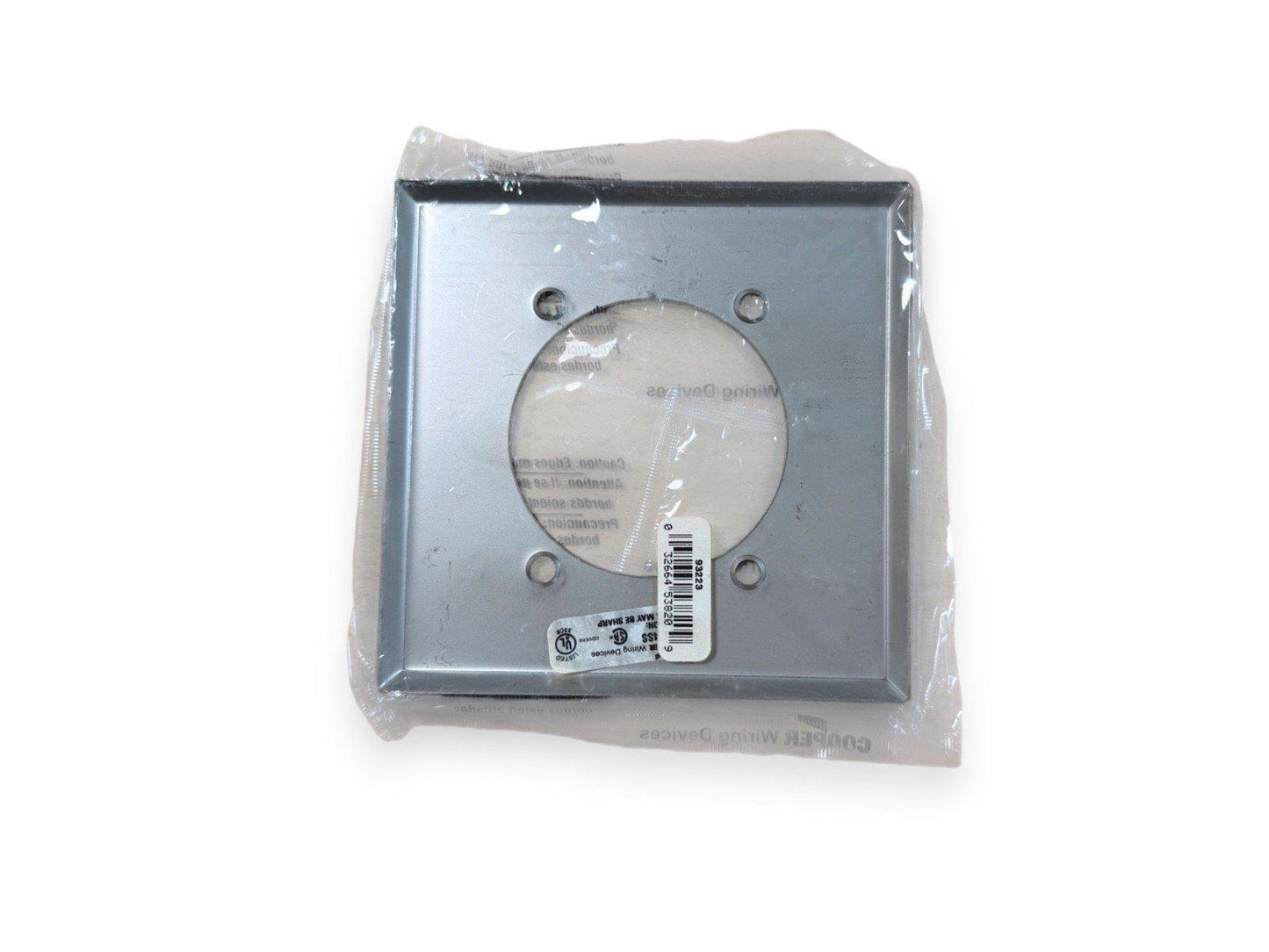 Square metal fire alarm mounting bracket with circular cutout, packaged in plastic wrap