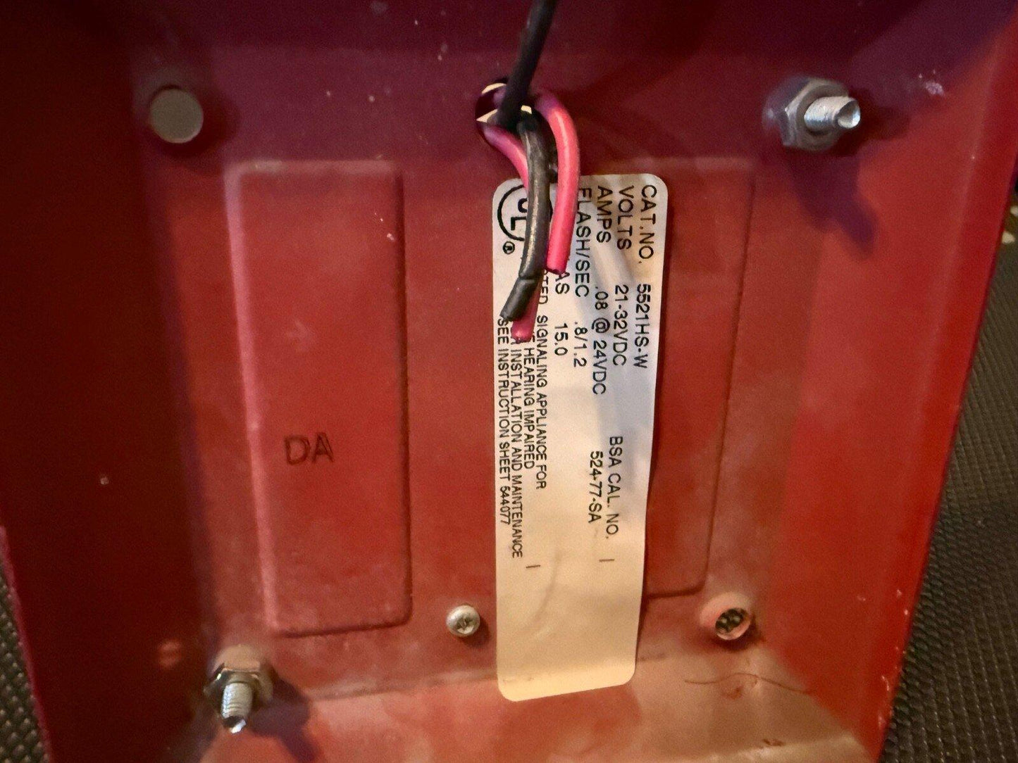 Red fire alarm device with wiring and spec label, model 5521HS-W, 21-32VDC