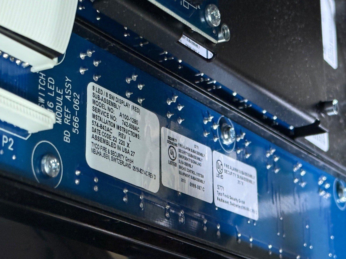 Tyco fire alarm control panel circuit board with UL listed labels and model details