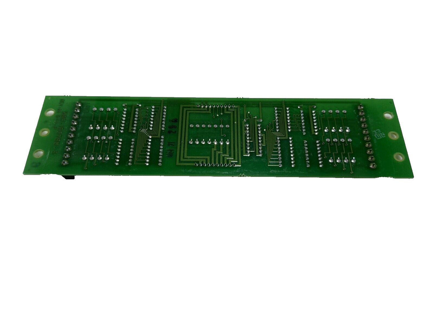 Green fire alarm control panel circuit board with solder points and traces, used fire alarm equipment