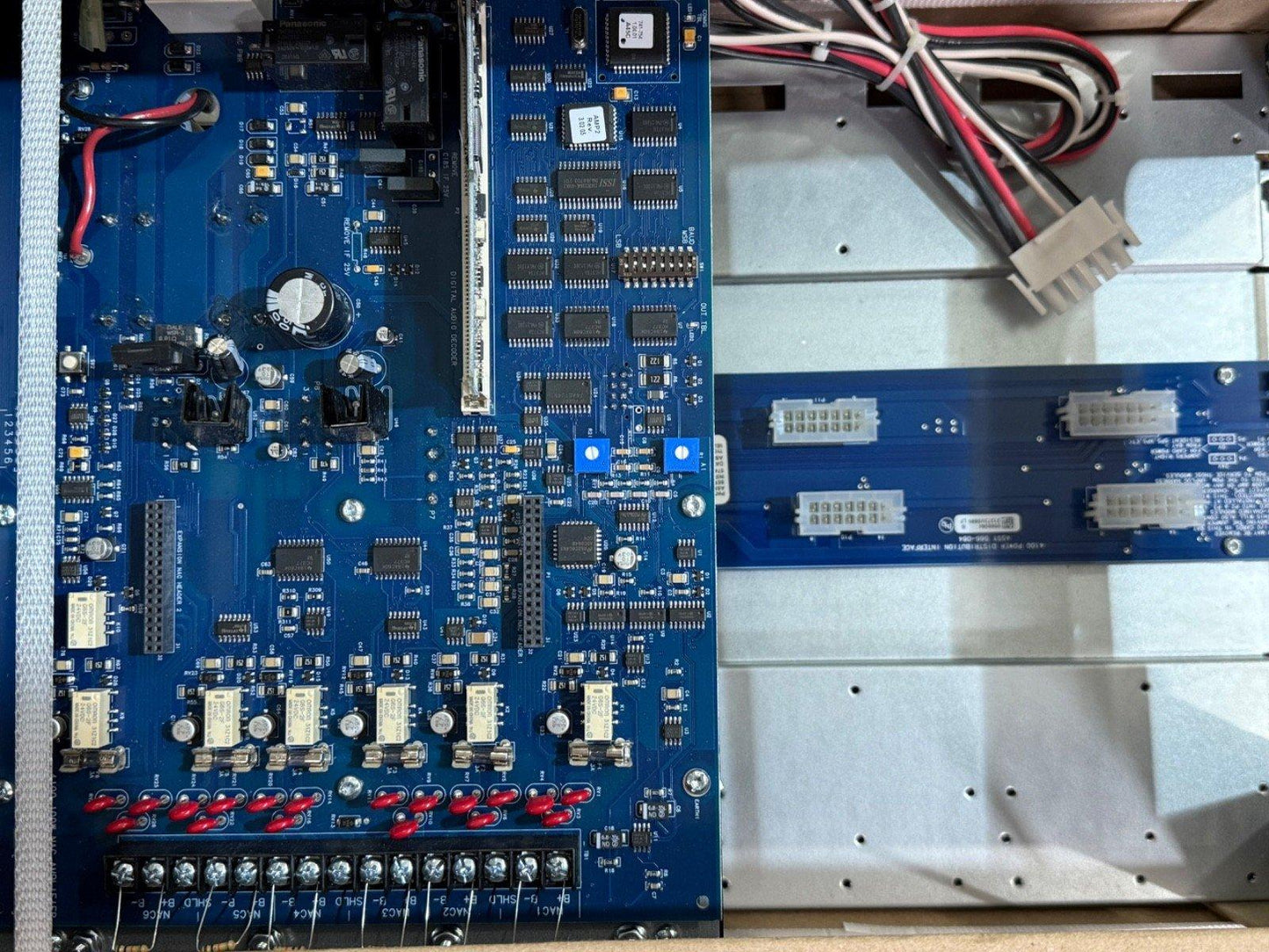 Fire alarm control panel circuit board with connectors and wiring for commercial systems