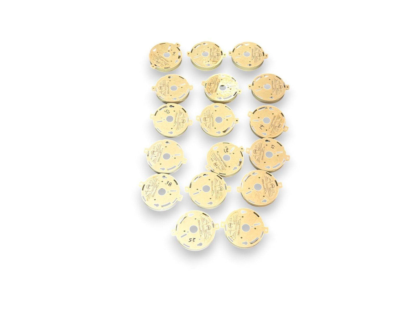 Round fire alarm base plates, used fire alarm equipment, gold-colored mounting bases for smoke detectors