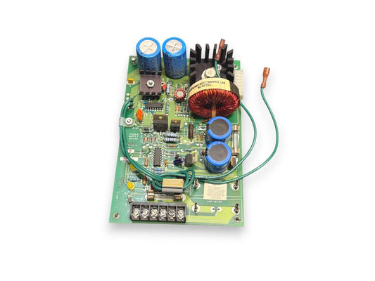 Fire alarm power supply board with capacitors, transformer, and wiring terminals for fire safety systems