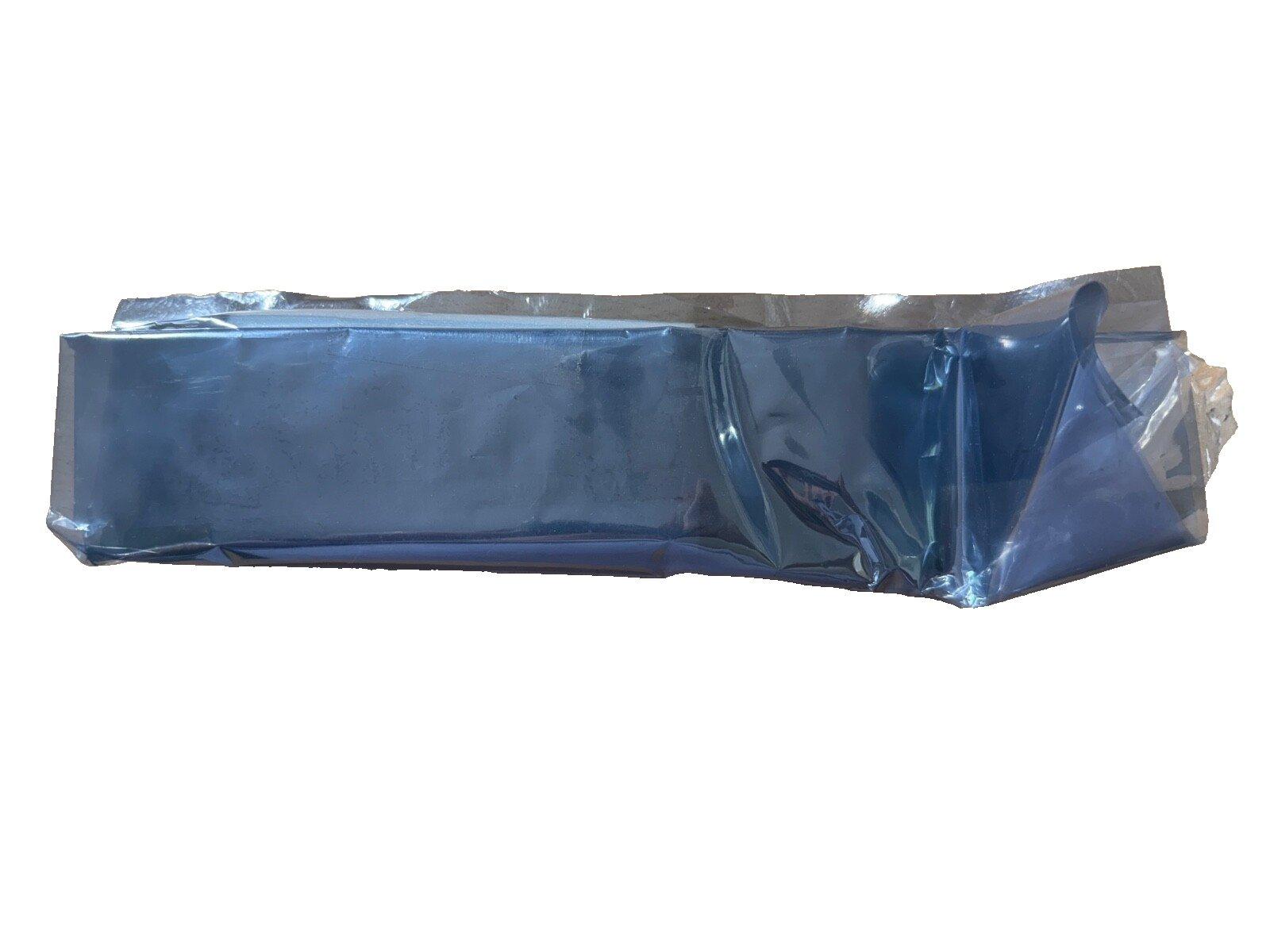 Sealed fire alarm equipment in protective plastic wrap, ready for installation or storage.