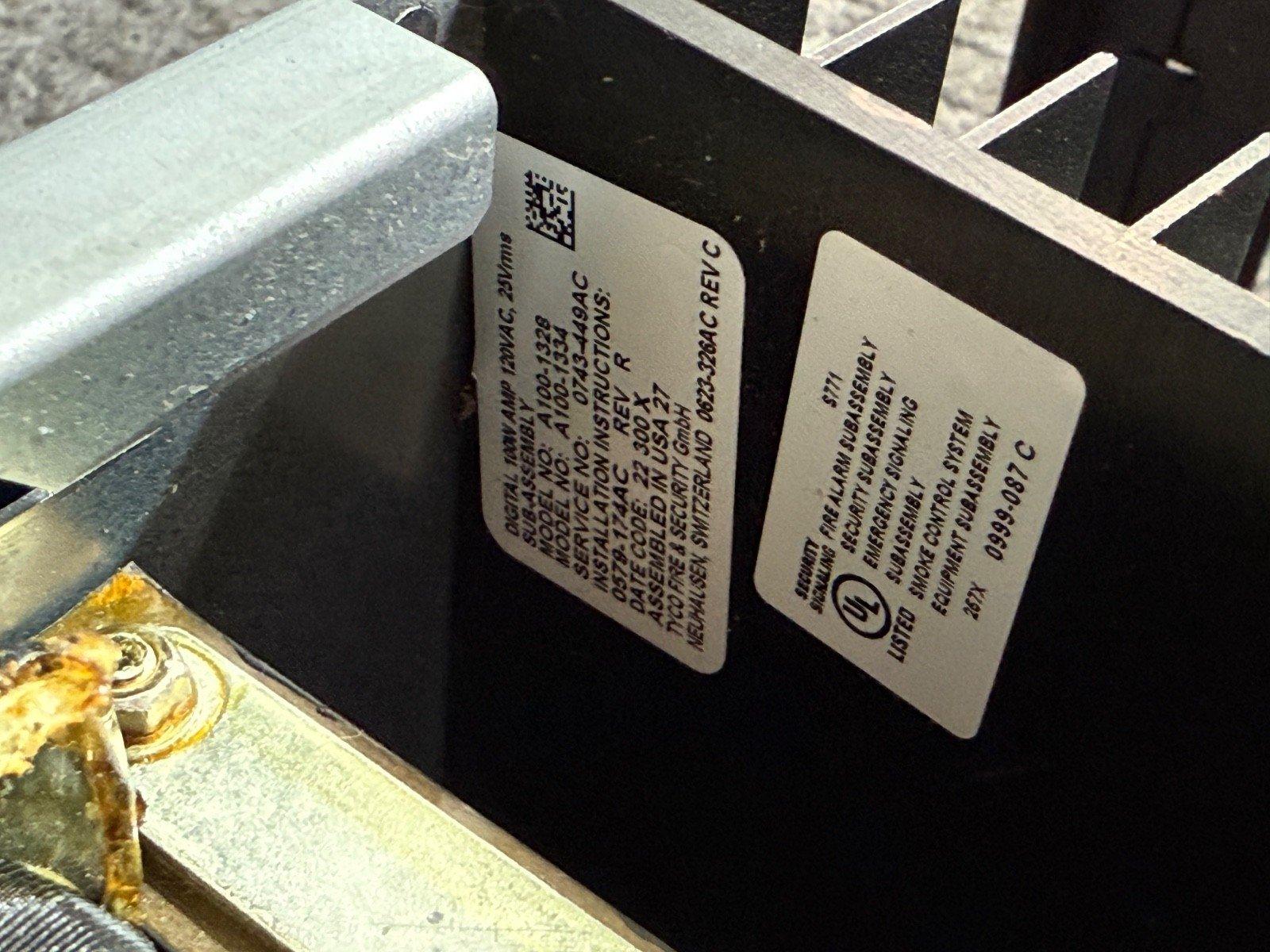 UL-listed fire alarm subassembly with model and service labels, security signaling equipment