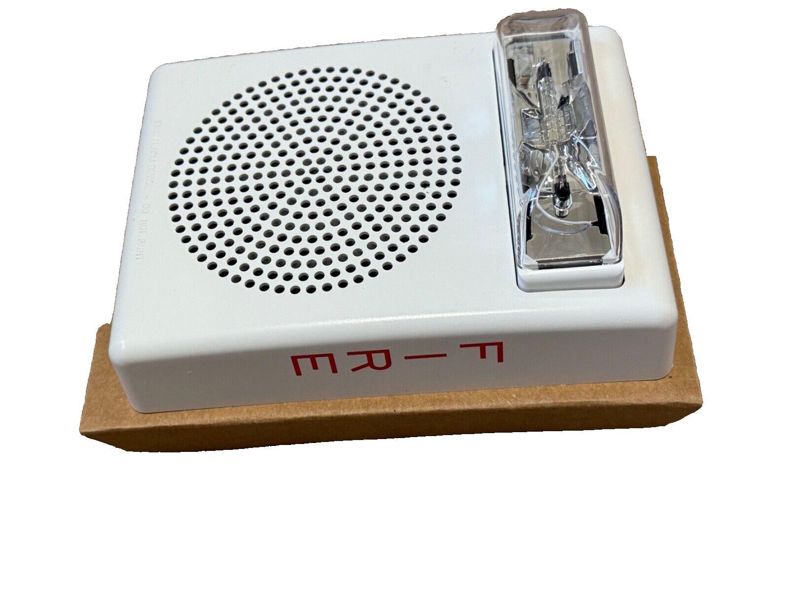 White fire alarm sounder with clear strobe light and red label, for commercial safety systems