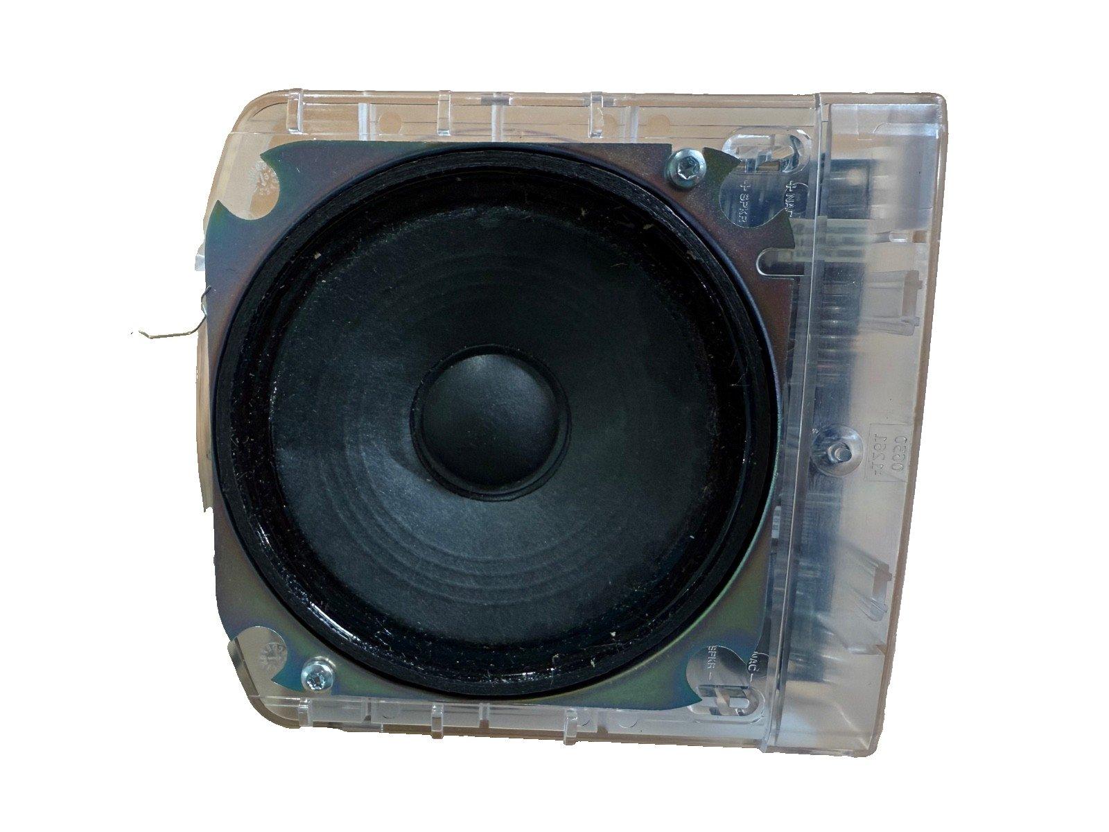 Fire alarm speaker with clear plastic housing and black cone, used for emergency notification systems