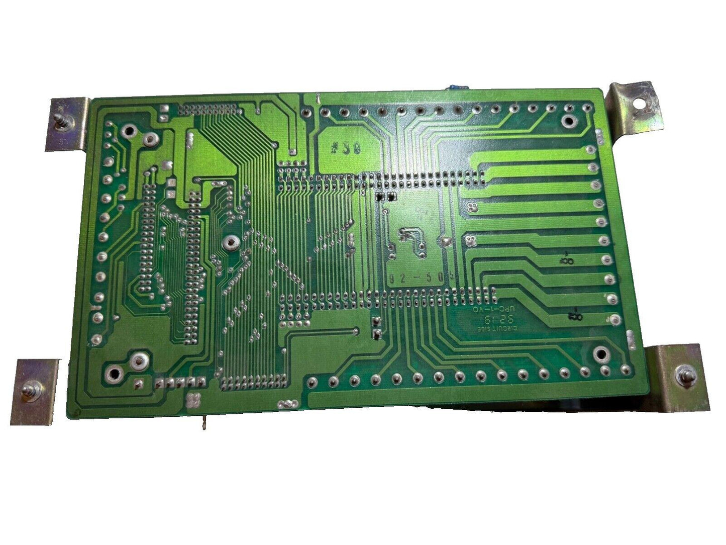 Green fire alarm control panel circuit board with mounting brackets, used fire alarm equipment