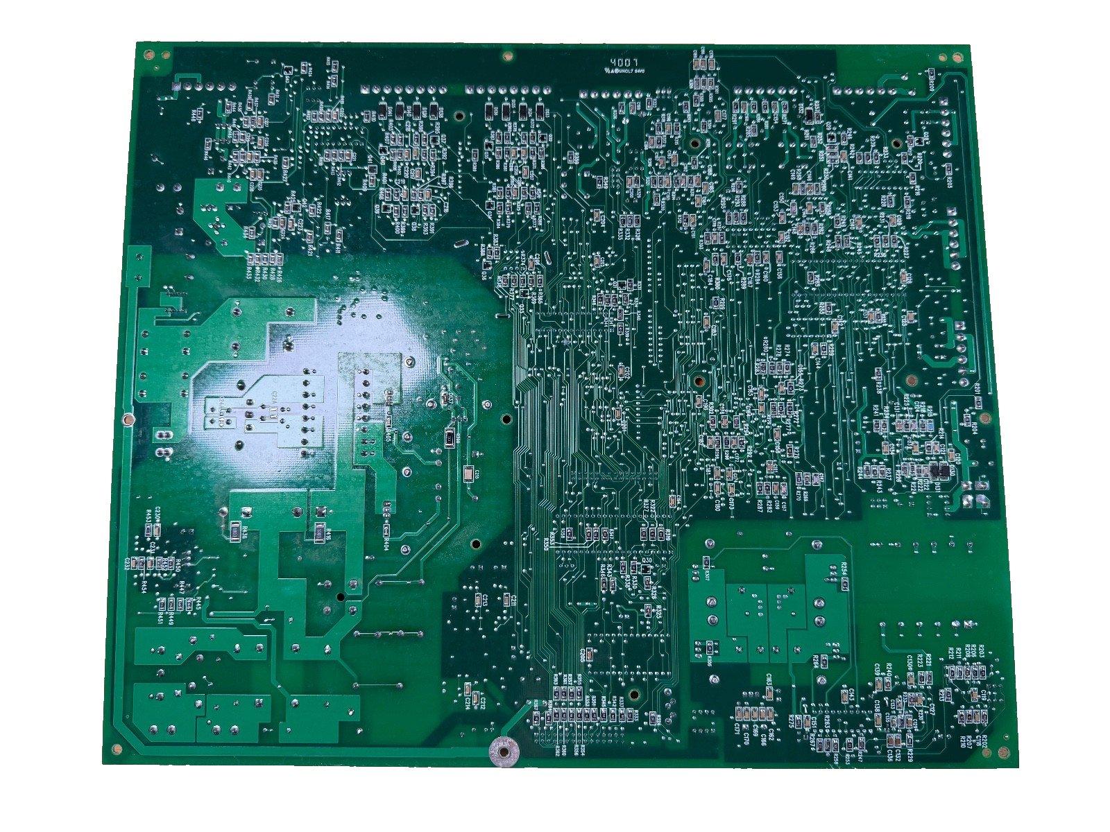 Green fire alarm control panel circuit board with detailed PCB traces and components