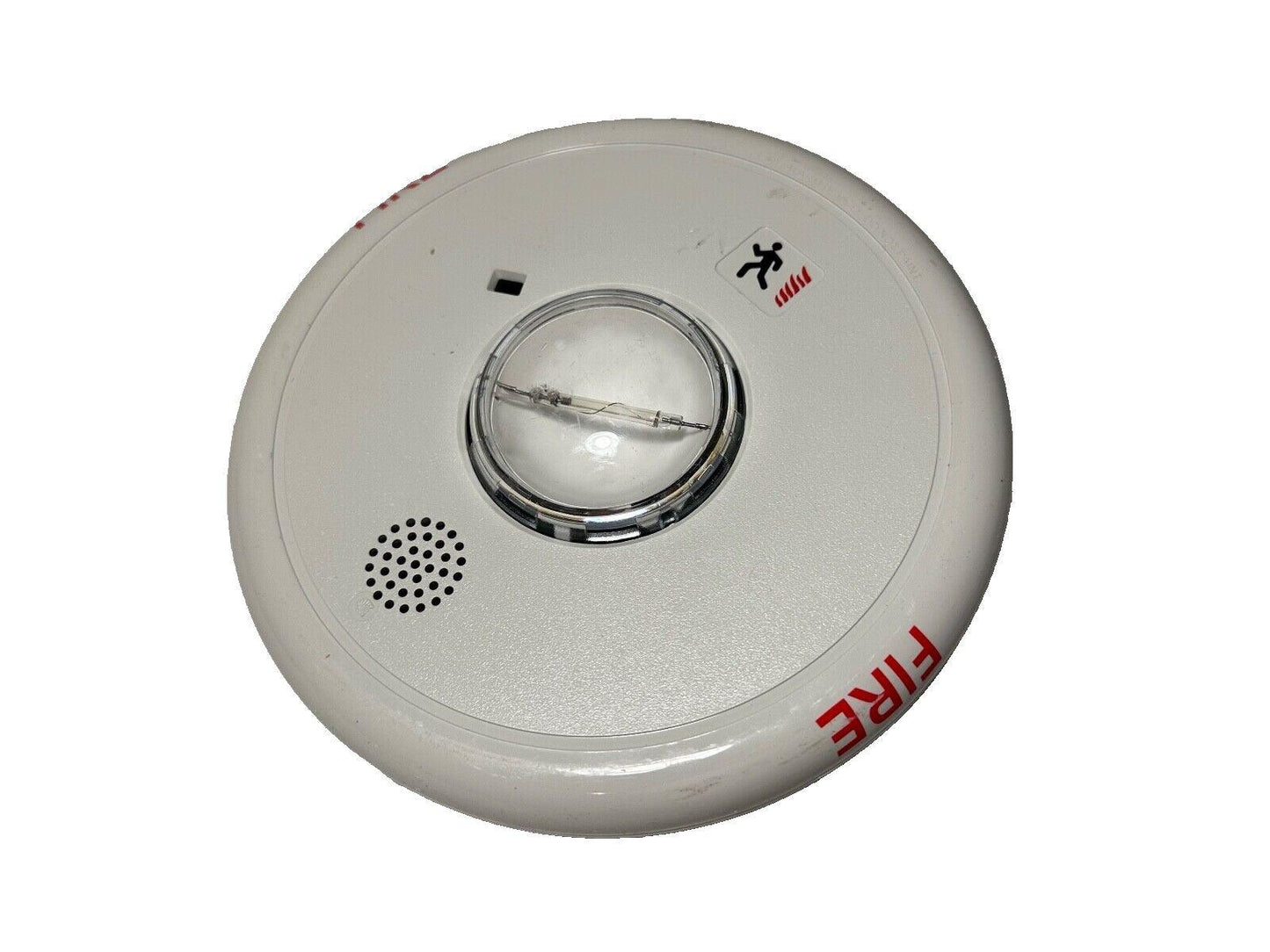 White fire alarm detector with red FIRE label and emergency exit symbol, used fire safety equipment