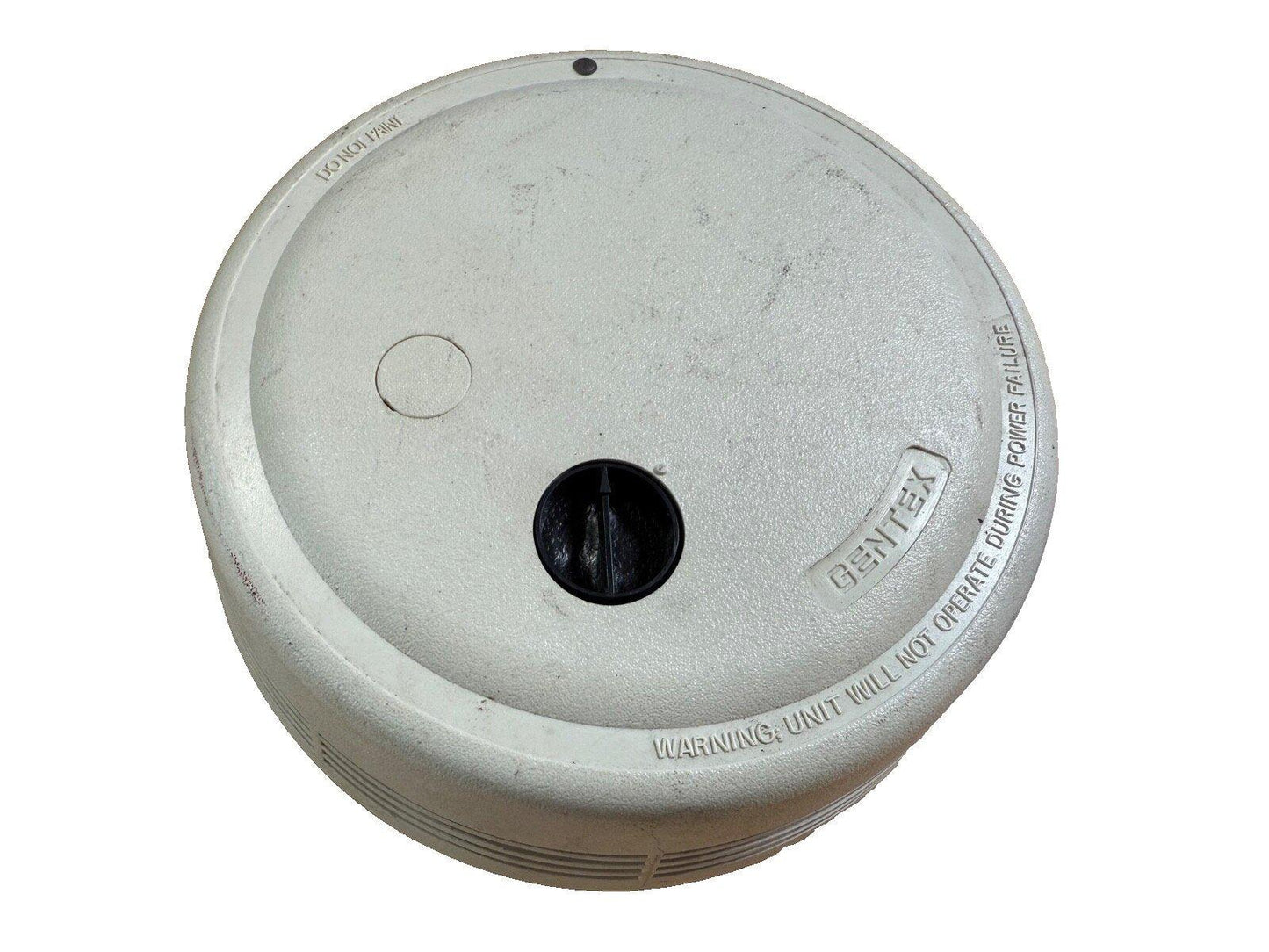 Gentex fire alarm detector with warning label, used fire safety equipment