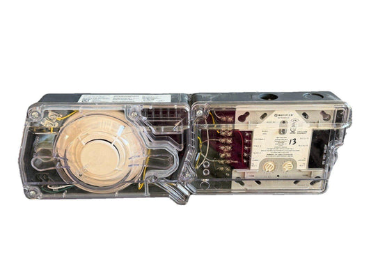 Honeywell Notifier fire alarm sounder with clear cover, internal wiring, and terminal connections visible