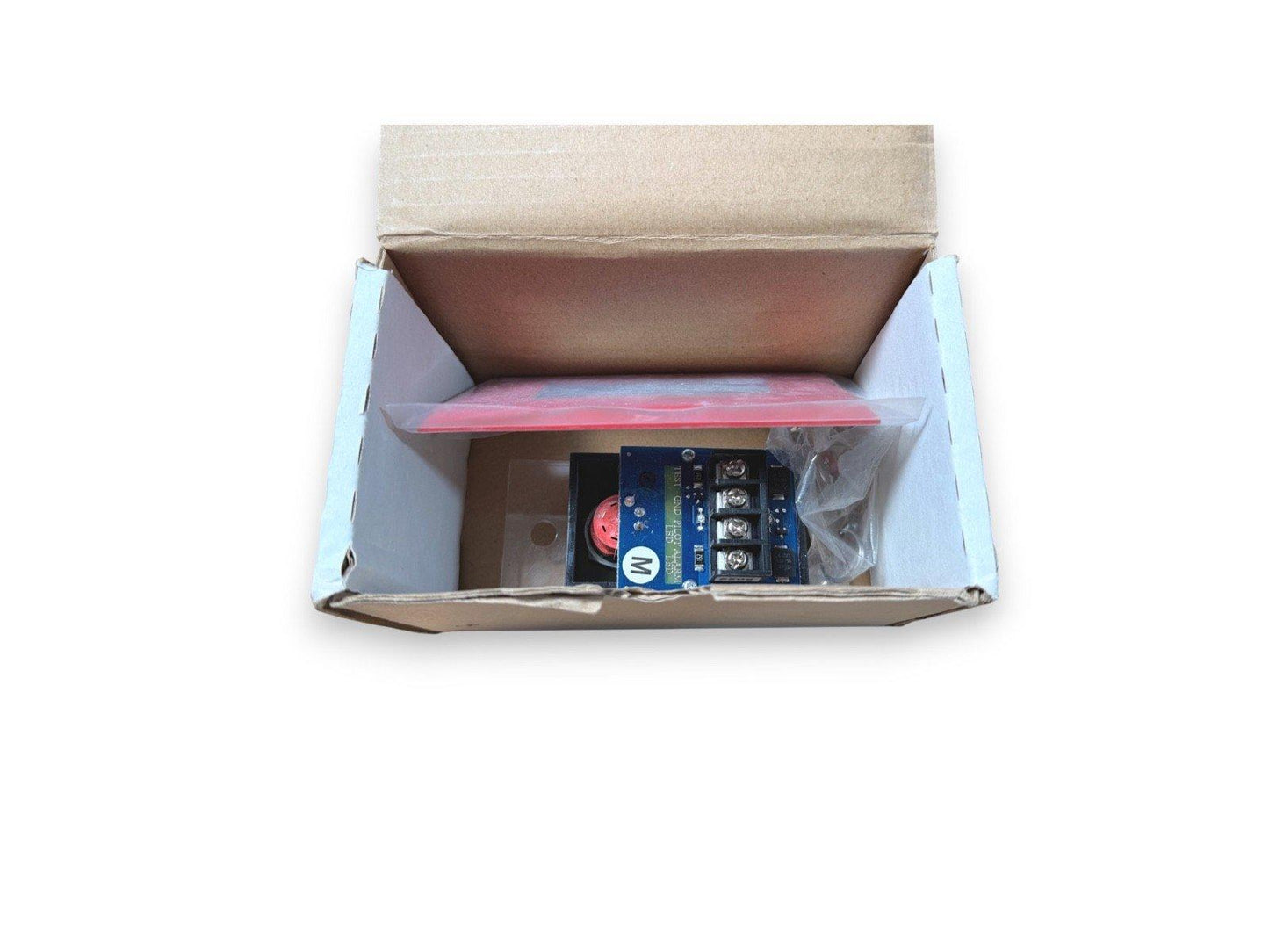 Fire alarm control module with red LED indicator in open box, ready for installation