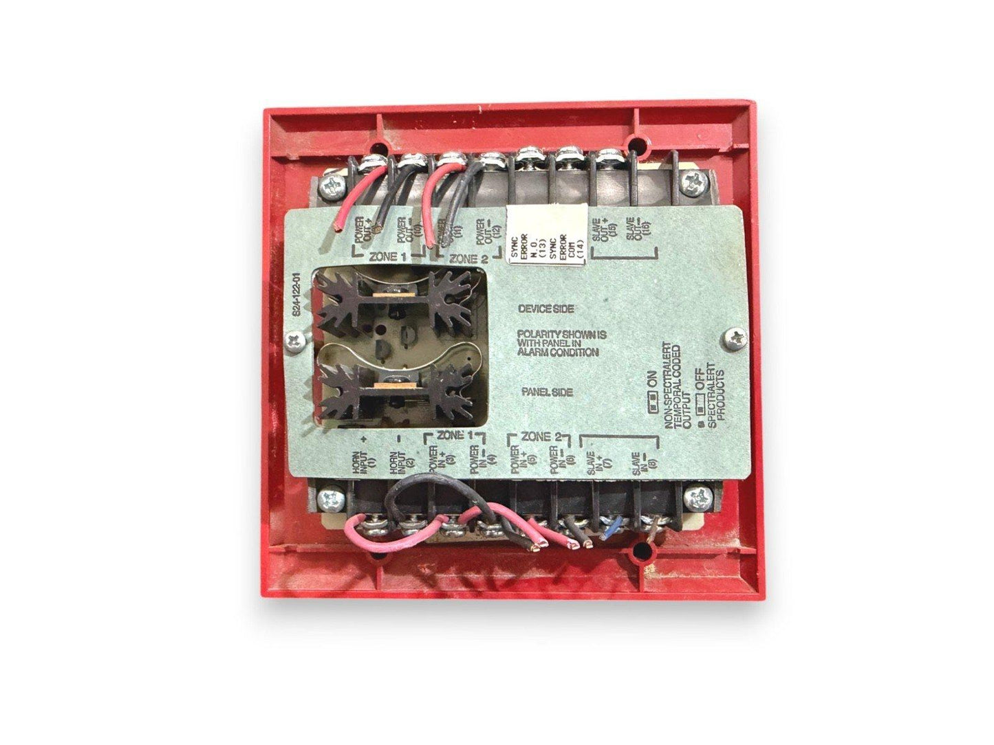 Red fire alarm control module with labeled terminals and wiring for Zone 1 and Zone 2