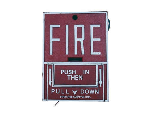 Red fire alarm pull station with 'PUSH IN THEN PULL DOWN' instructions, Fire-Lite Alarms Inc.