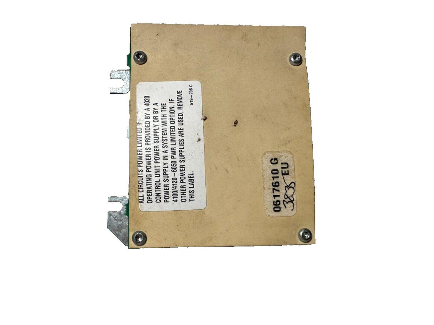 Fire alarm control module with power supply label and mounting screws, used fire safety equipment