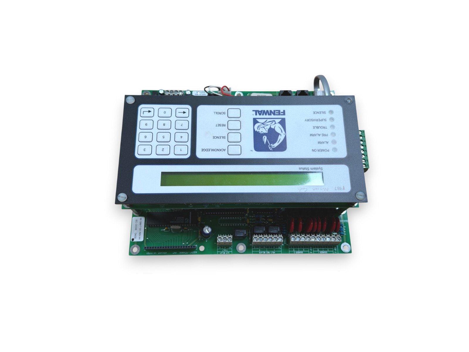 Fenwal fire alarm control panel with keypad, status indicators, and LCD display for system monitoring