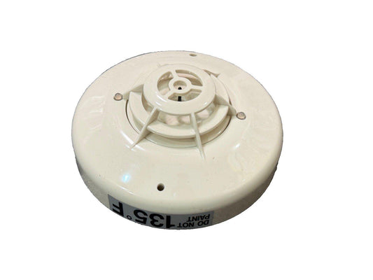 White 135°F heat detector for fire alarm systems, ceiling-mounted with 'Do Not Paint' label