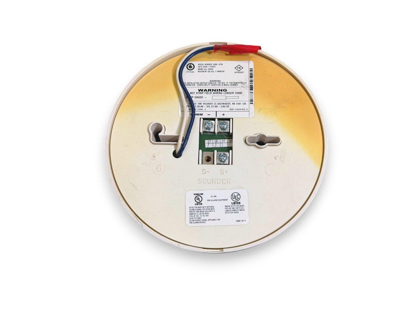 Fire alarm sounder base with wiring terminals and UL listed label for commercial fire safety systems