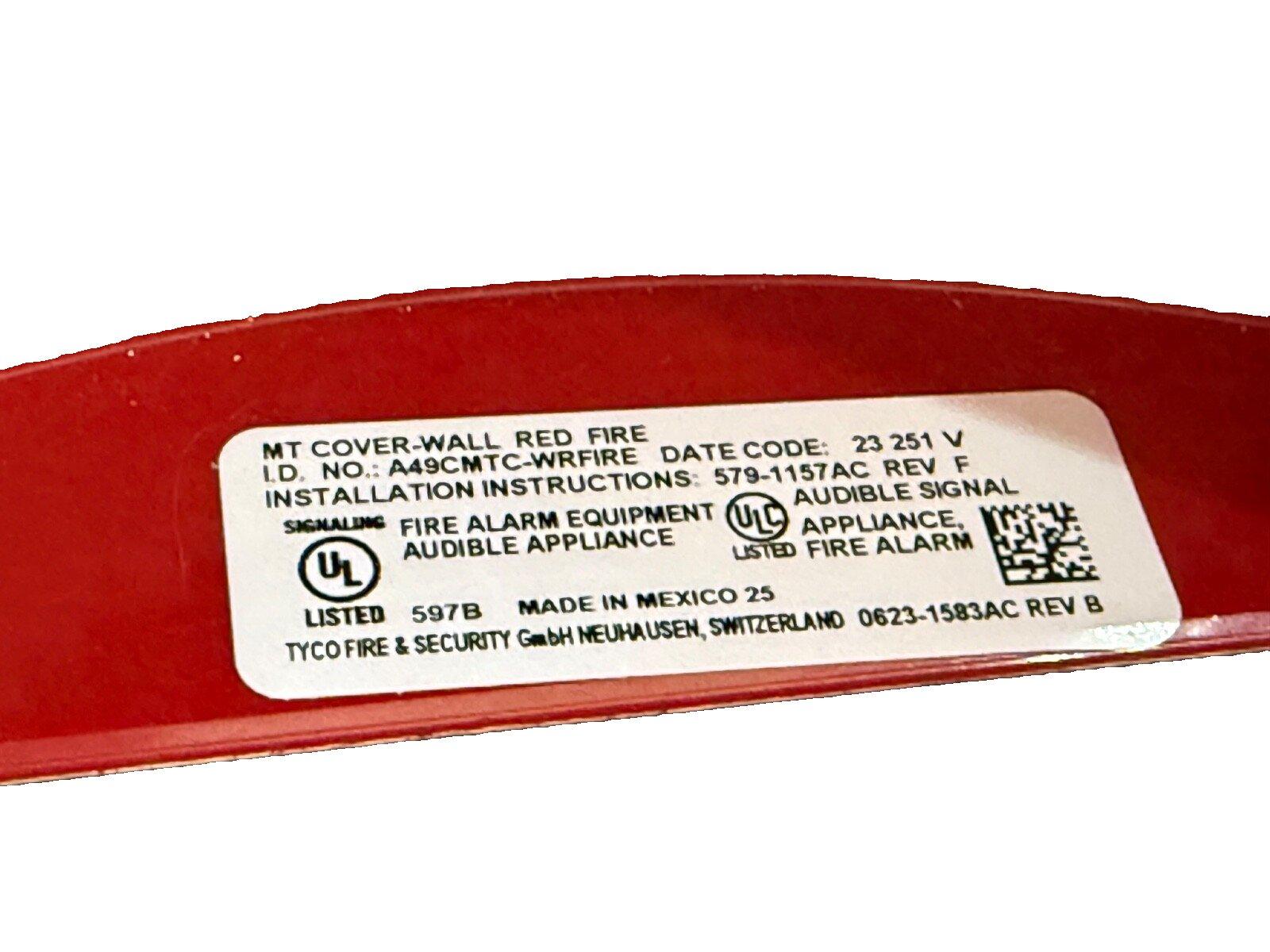 Red fire alarm device label showing UL listed audible signal equipment details